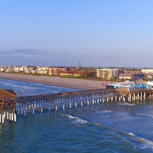 Cocoa Beach and its pier on a clear morning, near Port Canaveral